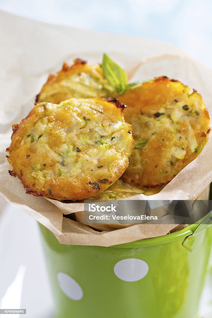 Baked zucchini muffins Baked zucchini appetizers with cheese and herbs Appetizer Stock Photo