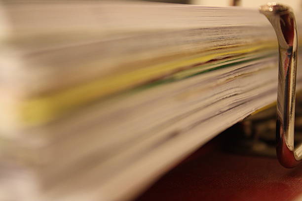 istock ring binder full of paper 474455009