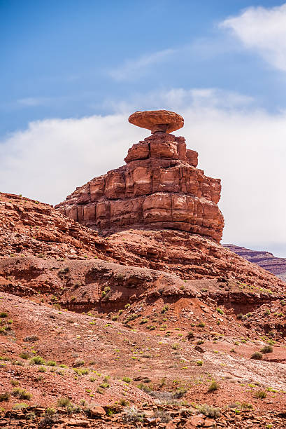 istock mexican hat rock monument landscape on sunny day 474456738