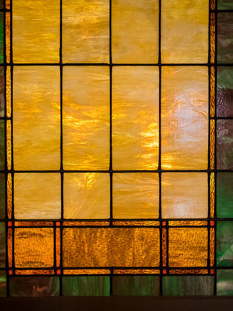 Yellow and Brown Stained Glass Window Yellow and Brown Stained Glass Window with some green stained glass photos stock pictures, royalty-free photos & images
