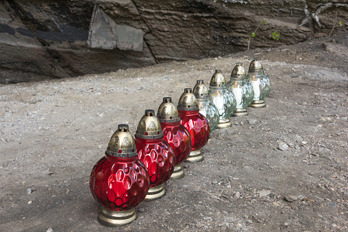 Red and clear commemorative candle viles in Muldorf Concentration camp