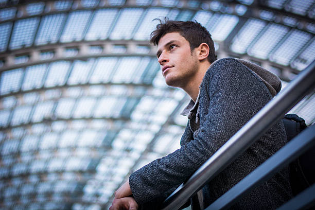 istock Attractive young man inside modern building, station or airport 474458158