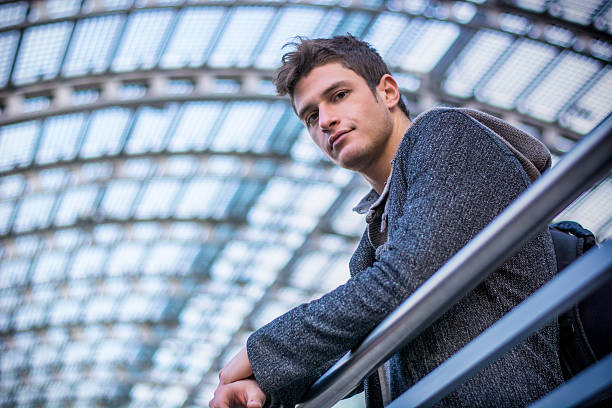 istock Attractive young man inside modern building, station or airport 474458168