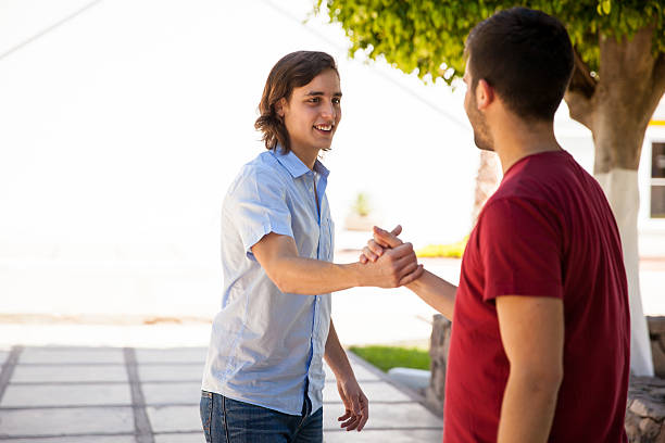 istock Male college students greeting 474459136