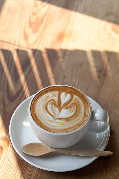 istock Cup of latte coffee on wooden 474460448