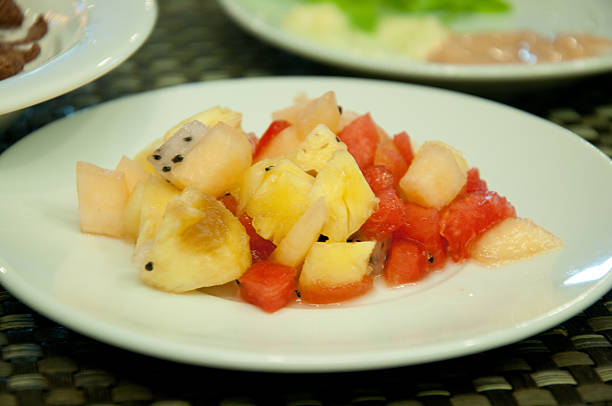 istock plate of fresh fruit salad on table 474460594