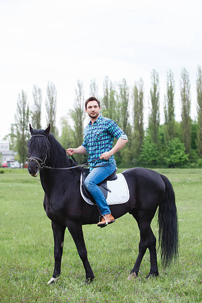 istock man riding a horse 474460884