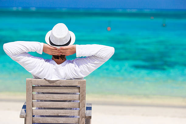 istock Young man enjoying summer vacation on tropical beach 474461252