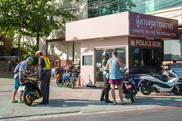 Road police check tourists on motorbike in Patong stock photo