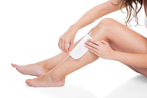 istock Woman Waxing Her Legs 474461734