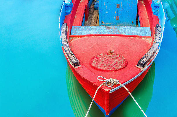 istock Empty red wooden boat with blue broadside 474464836