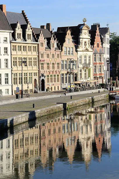 Photo of Traditional Belgian architecture buildings reflecting in water