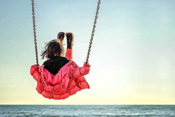 istock Little girl on the swing 474469720