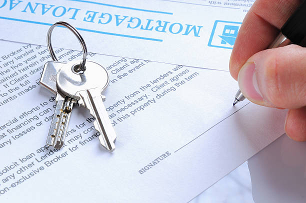 istock Client signing a mortgage loan agreement 474470204