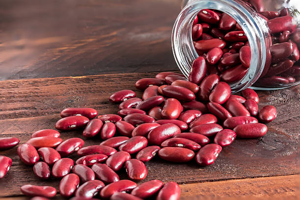 istock red kidney bean in glass bottle on wood table 474471166