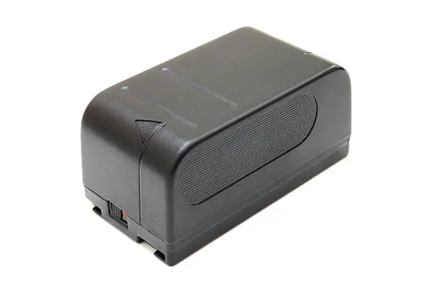 black small rectangular accumulator from a video camera on a white background