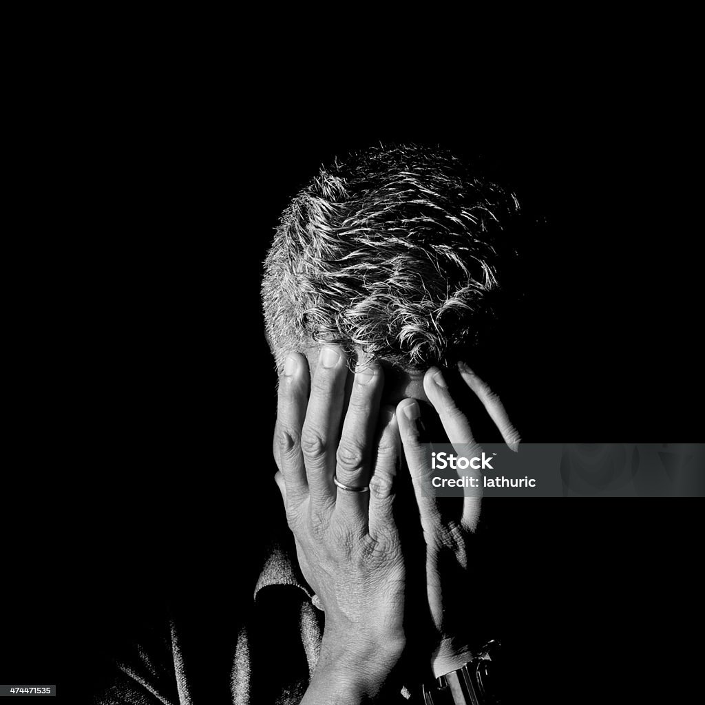 Man Frustrated and ashamed with hands on face Anxiety Stock Photo