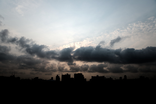 Early morning cloudscape with silhouette of building in Bangkok city