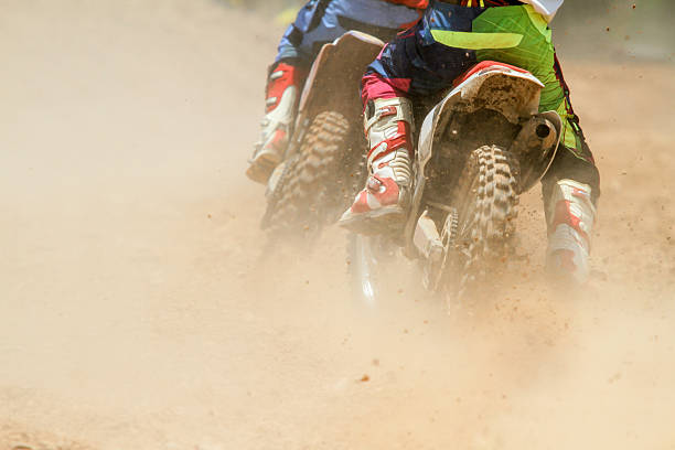istock motocross racer accelerating speed in track 474471884