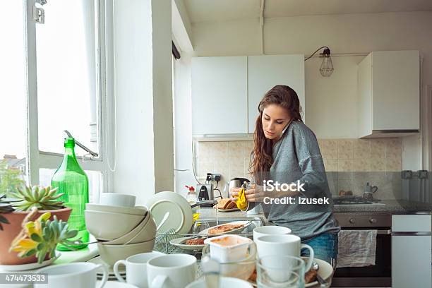 Woman Washing Dishes Stock Photo - Download Image Now - Messy, Kitchen, Women