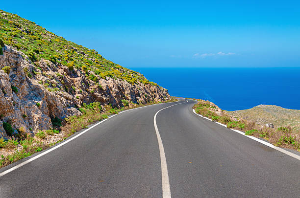 Curvy Asphalt Road Leading To Amazing Sea Bay Stock Photo - Download Image  Now - Greece, 2015, Aegean Sea - iStock