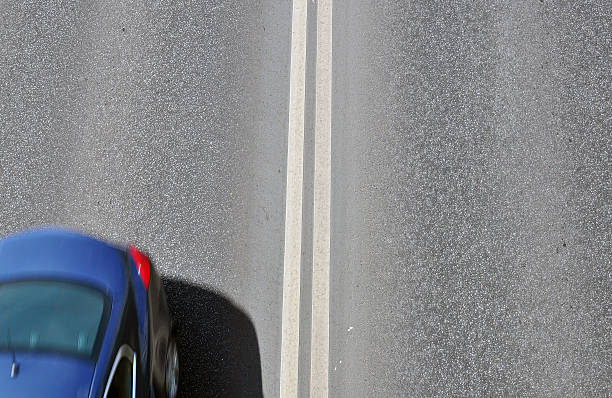 istock Silhouette of a car on the road 474476646