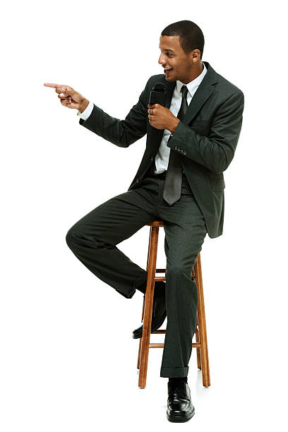 istock News reporter pointing at something 474476808