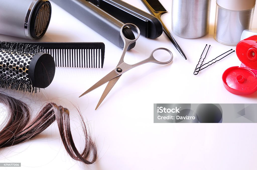 Set hairdressing articles on a white table Set hairdressing articles exposed on a white table with room below right to write 2015 Stock Photo