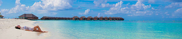 istock Young woman enjoy tropical beach vacation 474478164
