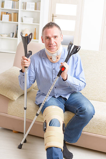istock Man with leg in knee cages 474480138