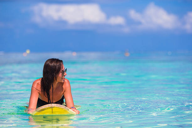 istock Beautiful surfer woman surfing during summer vacation 474480290