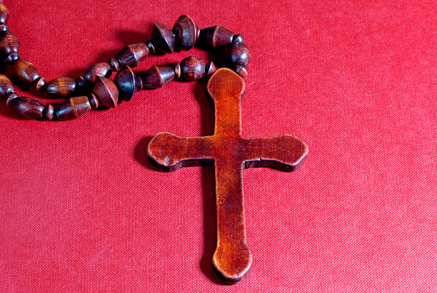 istock Christian cross on red  cardboard 474481389