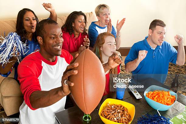 Diverse Group Of Family And Friends Watching A Football Game Stock Photo - Download Image Now