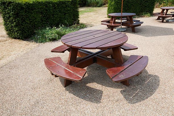 istock Wooden picnic tables in park 474484619