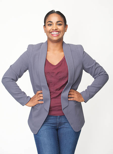 istock Happy young woman smiling with hands on hip 474484963