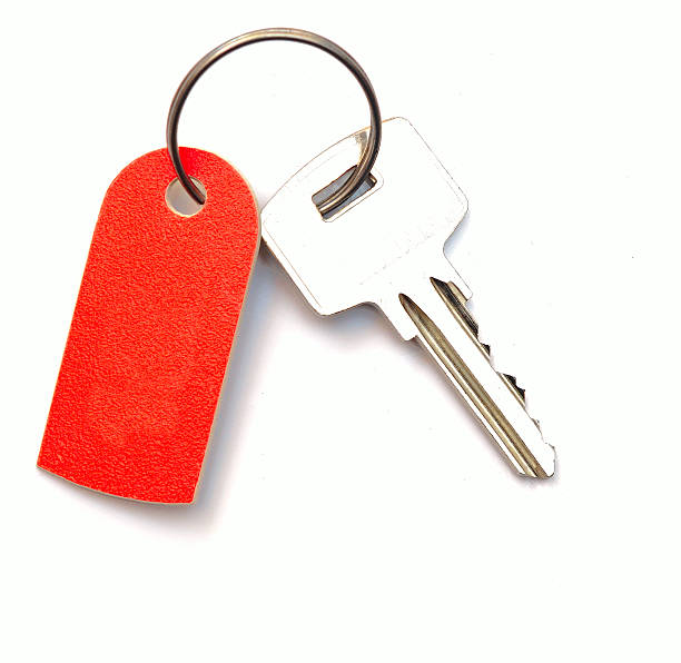 istock Blank tag and a key isolated on white background 474485885