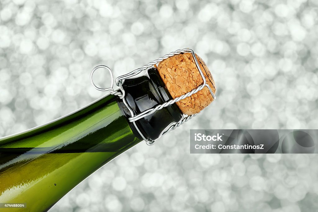 champagne closeup of champagne bottle with cork against abstract background 2015 Stock Photo