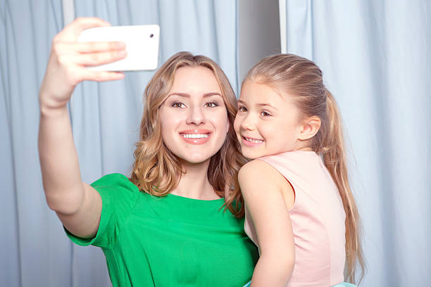 istock Young woman making selfie in a fitting room 474489366