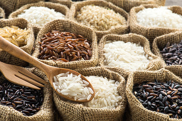 istock Close-up jasmine rice on wooden spoon 474491854