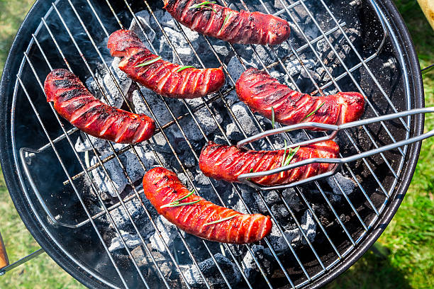 istock Roasted sausages with rosemary on a grill 474492048
