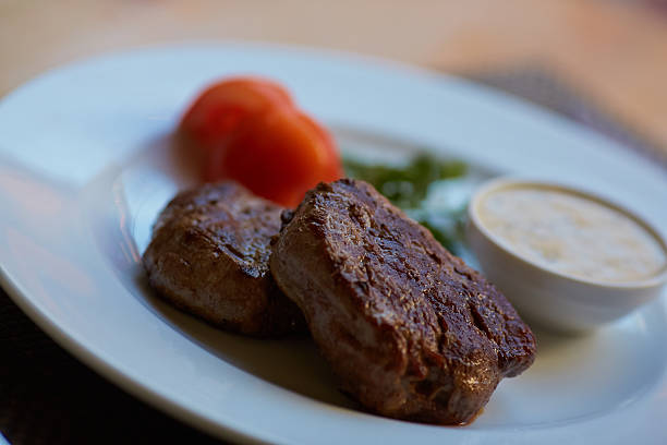 istock steak with sauce and vegetables 474492420