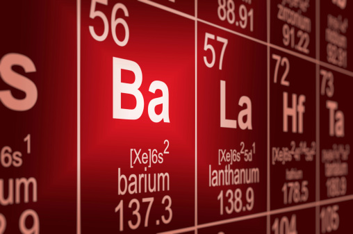 Detail of a partially blurred periodic table of the elements. Focus on barium