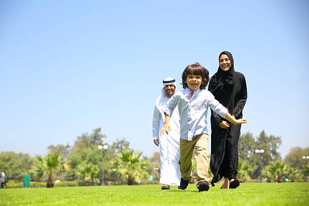Arab family enjoying their leisure time in park.