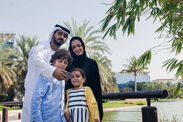 istock Middle Eastern Family Taking Selfie Outdoors 474496260