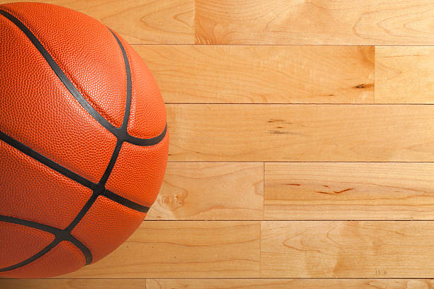 istock Basketball on wood gym floor viewed from above 474497783