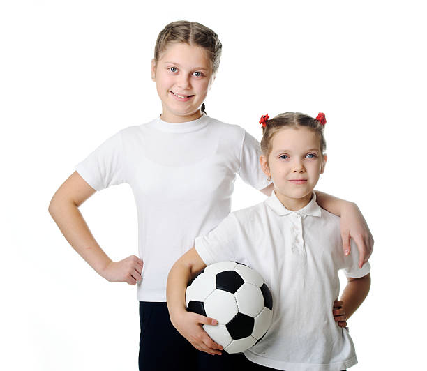 istock Sisters holding a soccer ball 474497817