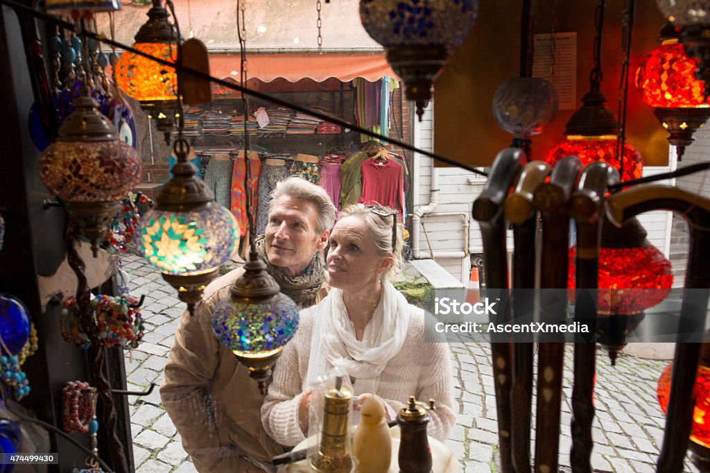 Travellers shop for handicrafts in bazaar Travellers shop for handicrafts in bazaar, Istanbul 2015 Stock Photo
