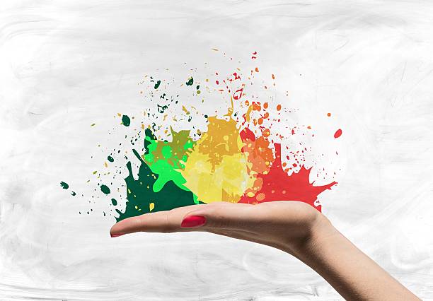 istock Open woman palm with splatters 474499524