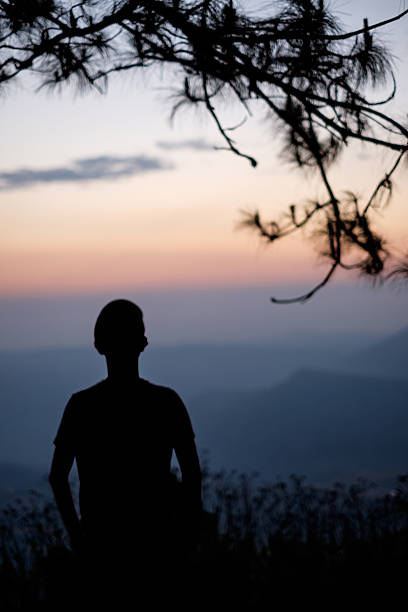istock Silhouette of man on the mountain with sunrise. 474500146