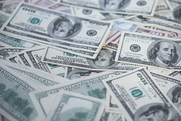 istock money in a chaotic manner on the floor 474500216